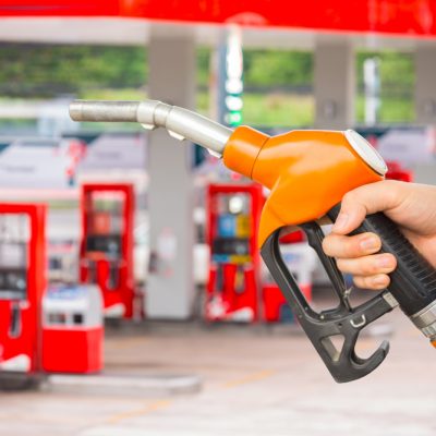 man-hold-fuel-nozzle-add-fuel-car-gas-station